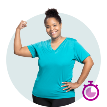 Woman flexing bicep in teal shirt